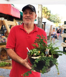 Man holding dish fairy garden